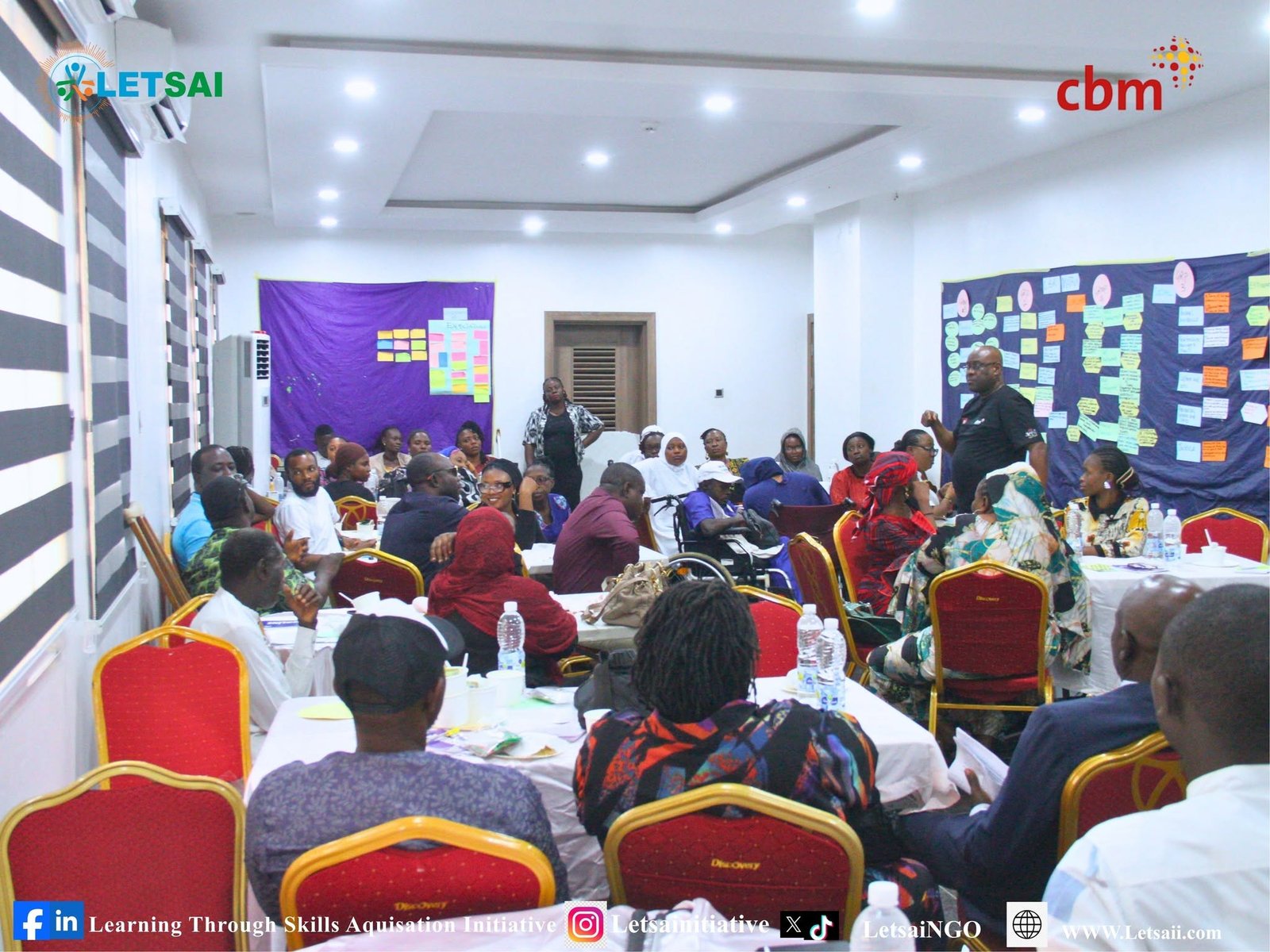 Participants discussing disability inclusion in a LETSAI workshop, shared on Facebook in October 2026